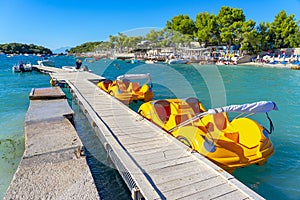 jetty for pleasure boats in the crystal-clear bathing area of Ã¢â¬â¹Ã¢â¬â¹Bora Bora beach in Ksamil, Albania.